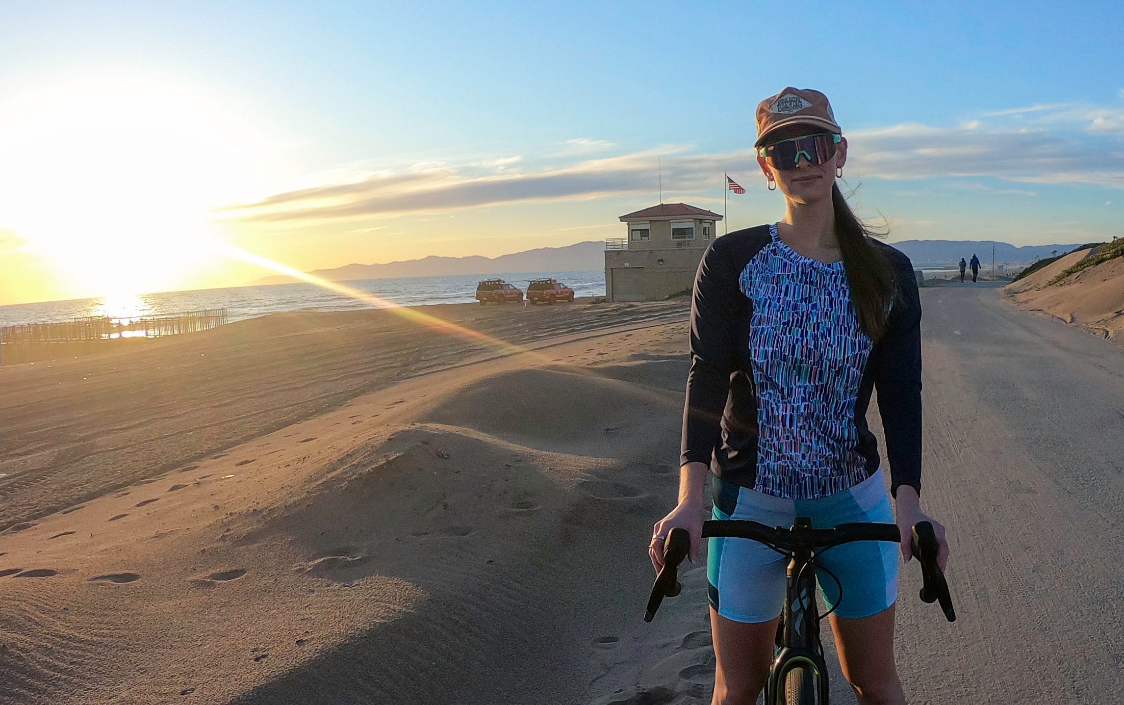 Moxie Tee Jersey Blues Long Sleeve for cycling in scenic sunset.